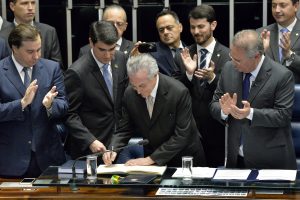 Brazilian President Michel Temer (C), accompanied by Deputy Rodrigo Maia (L) and Senator Renan Calheiros (R) during Temer's swearing-in, at the National Congress in Brasilia, Brazil, 31 August 2016. Temer was sworn as the new president of Brazil after the impeachment of the president Dilma Rousseff. EPA/Cadu Gomes