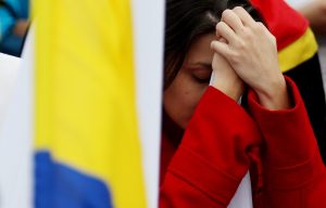 A woman reacts after hearing the results of the peace deal referendum in Bogota, Colombia, 02 October 2016. Colombians voted 'No' to the peace pact signed less than a week ago between the government and the FARC guerrillas, according to official results with 99.64 percent of the votes counted. EPA/LEONARDO MUNOZ