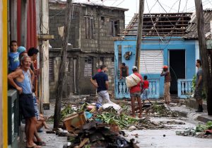 Cubans pick up the pieces following the damage and havoc caused by Hurricane Matthew in Baracoa, Cuba, 6 October 2016. Matthew has crossed over parts of Haiti and Cuba and is expected to move up the east coast of the United States. EPA/Alejandro Ernesto