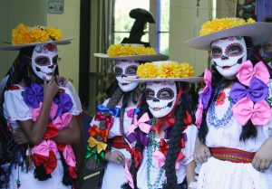 Children wear masks for the celebration.